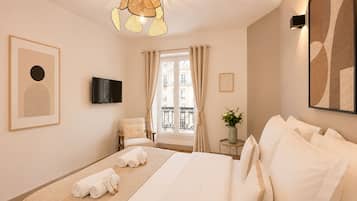 Superior Apartment, Courtyard View | Living area | 80-cm Smart TV with digital channels