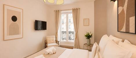 Superior Apartment, Courtyard View | Living area | 80-cm Smart TV with digital channels