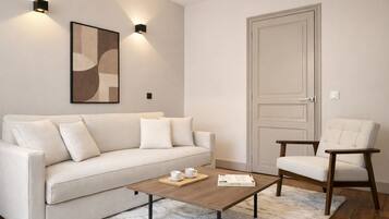 Superior Apartment, Courtyard View | Living area | 80-cm Smart TV with digital channels