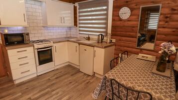 Fridge, microwave, cookware/dishes/utensils