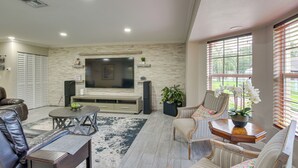 A living room with a TV, seating, and a fireplace. - 16 Mi to Fort Lauderdale: Florida Escape w/ Pool! (Plantation)