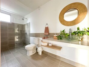 Shower, towels, soap, toilet paper