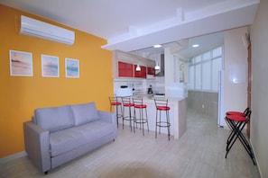 Family Apartment | Living area | 42-inch Smart TV with cable channels