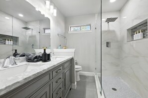 Shower, hair dryer, towels, shampoo