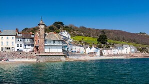 A coastal town with a prominent clock tower, historic buildings, and a beach. - Stunning  villa for 6 people with WIFI and pets allowed (Cawsand)