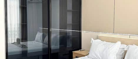 Family Condo, Balcony, City View | Desk, laptop workspace, blackout curtains, iron/ironing board