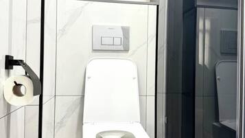 Family Condo, Balcony, City View | Bathroom | Shower, free toiletries, hair dryer, towels