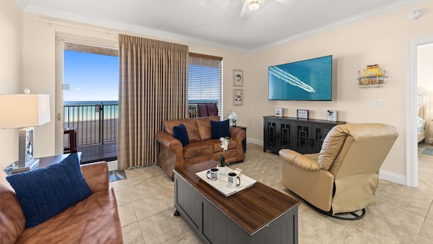 A living room with a sofa, a recliner, a coffee table, and a TV.