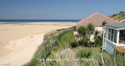 Treville soaks up the sun, which can be enjoyed from the deck with sea views.