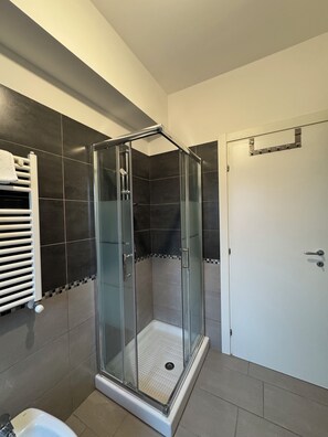 Shower, eco-friendly toiletries, hair dryer, bidet