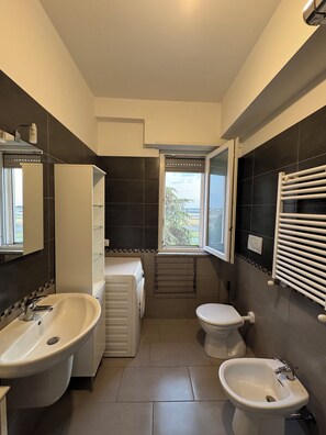 Shower, eco-friendly toiletries, hair dryer, bidet