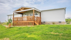 A two-story house with a wooden deck and a covered porch. - Stillwater Hollow - For 8! (Williamstown)