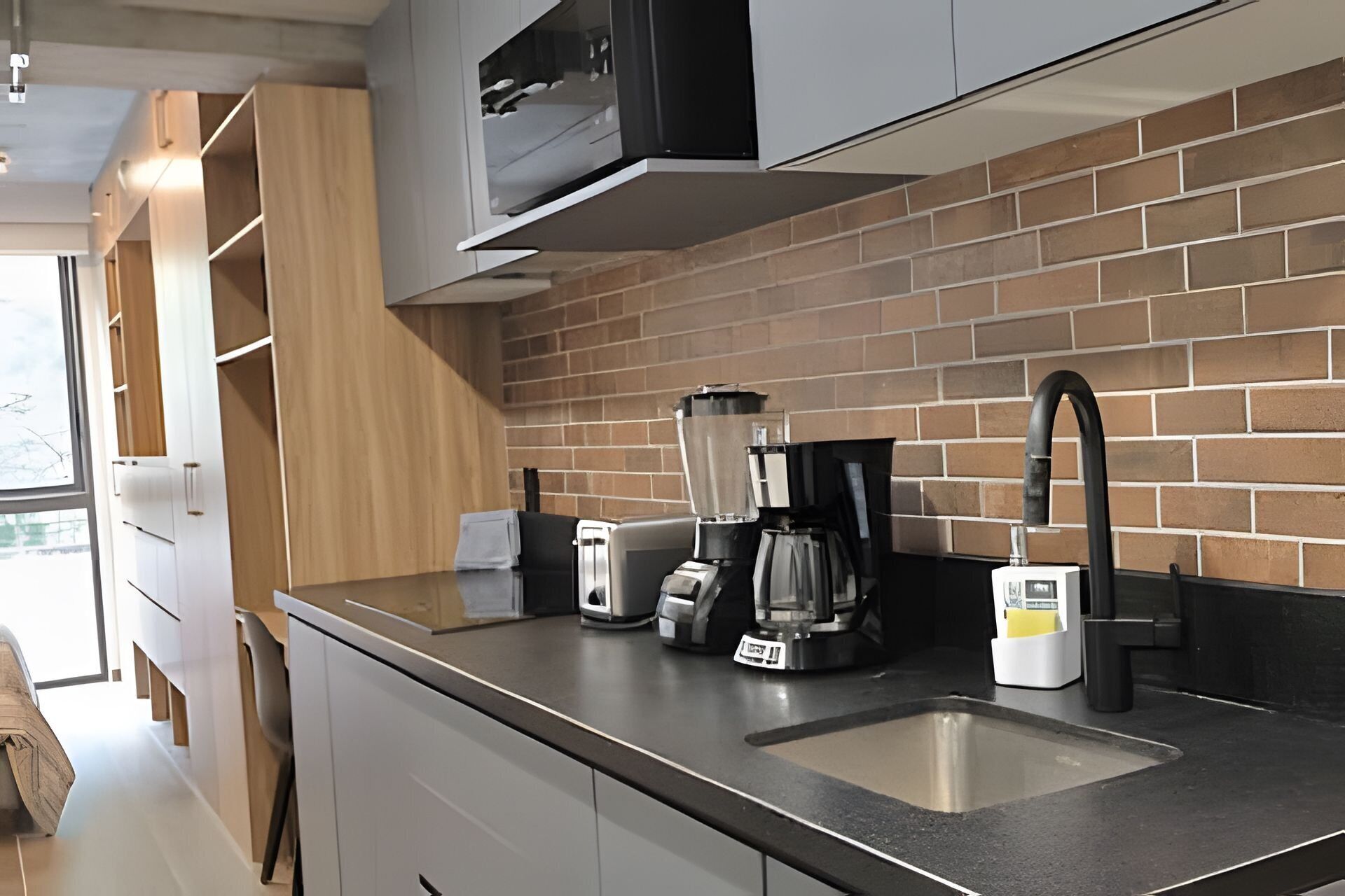 Fridge, microwave, coffee/tea maker, cookware/dishes/utensils