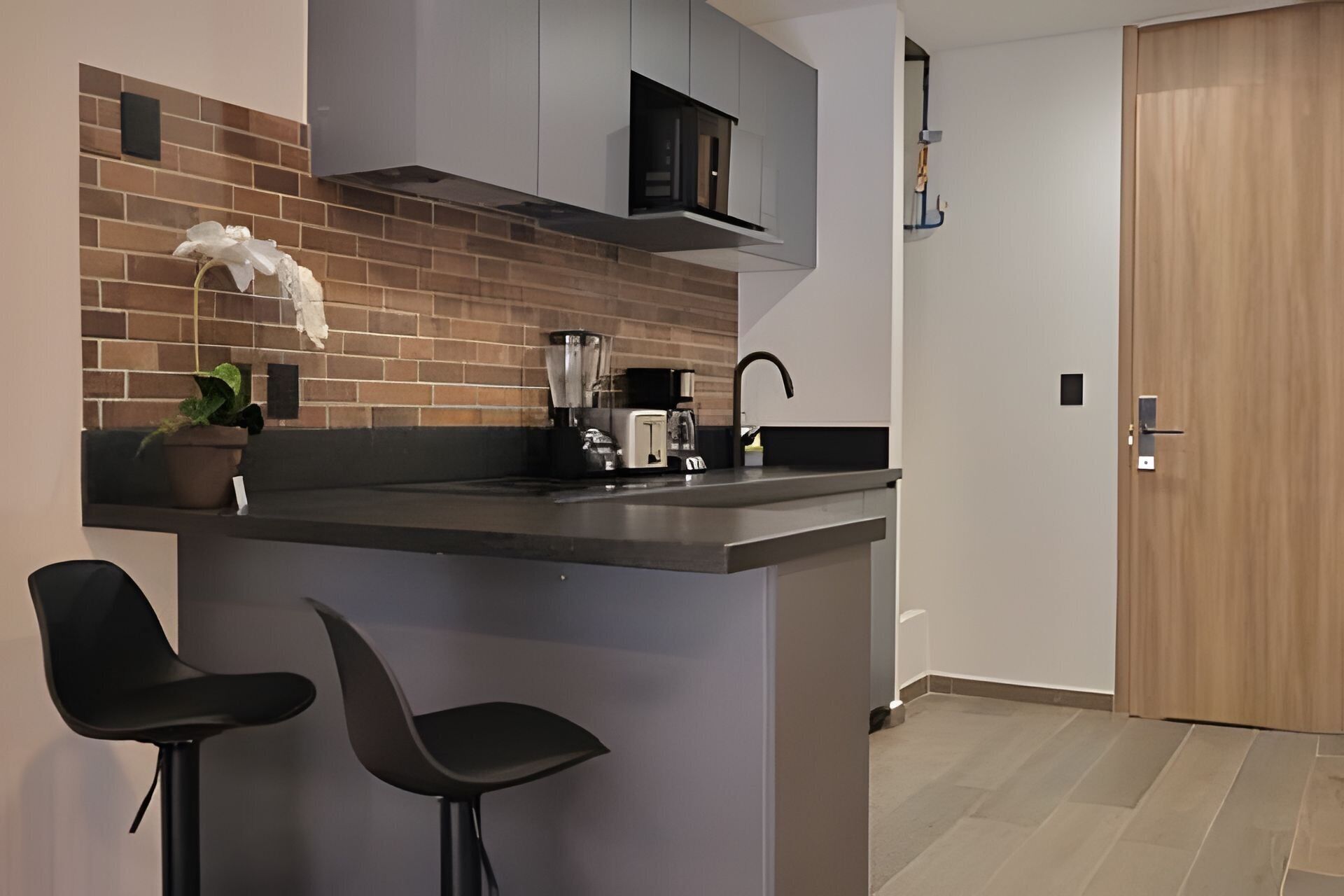 Fridge, microwave, coffee/tea maker, cookware/dishes/utensils