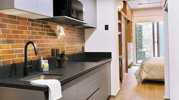 Fridge, microwave, stovetop, coffee/tea maker