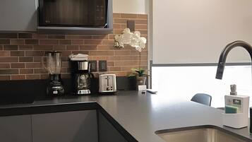 Fridge, microwave, stovetop, coffee/tea maker