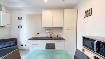 Apartment (1 Bedroom) | Living area | TV