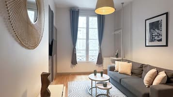 Classic Apartment, Courtyard View | Living area | 80-cm Smart TV with digital channels