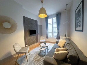 Classic Apartment, Courtyard View | Living area | 80-cm Smart TV with digital channels