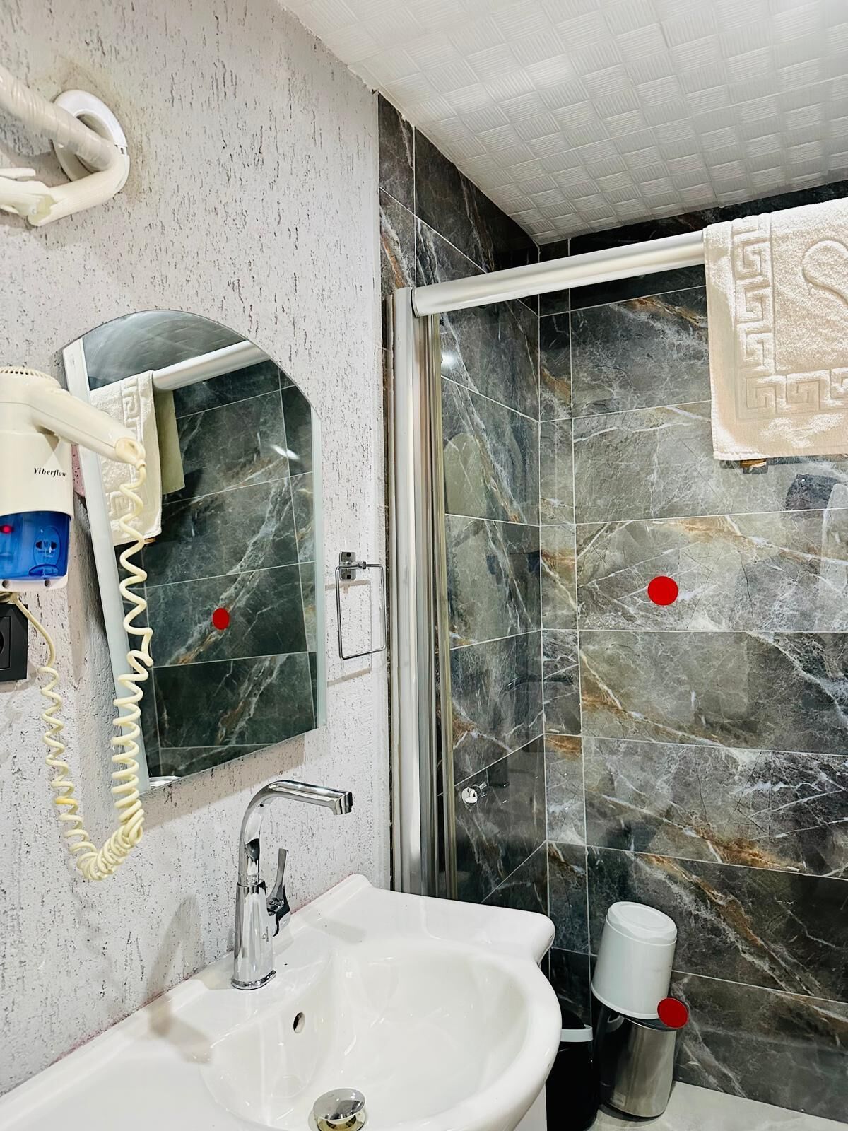 Combined shower/tub, hair dryer, towels, soap