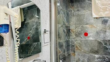 Combined shower/tub, hair dryer, towels, soap