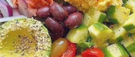 A salad bowl with various vegetables and proteins.