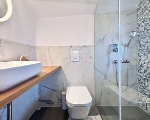 Shower, hair dryer, towels, soap