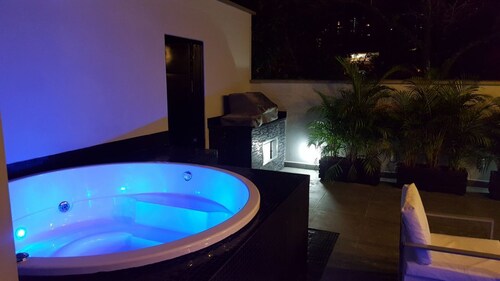 Spacious 12-bedroom house in Medellín with 2 Private Rooftop Jacuzzis and AC