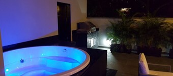 Spacious 12-bedroom house in Medellín with 2 Private Rooftop Jacuzzis and AC