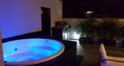 Spacious 12-bedroom house in Medellín with 2 Private Rooftop Jacuzzis and AC