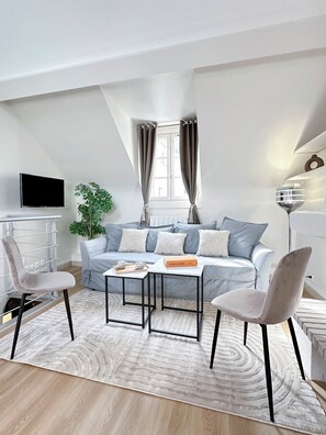 Deluxe Duplex, Courtyard View | Living area | 80-cm Smart TV with digital channels