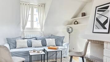 Deluxe Duplex, Courtyard View | Living area | 80-cm Smart TV with digital channels