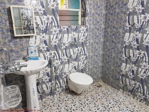 Shower, towels, soap, toilet paper