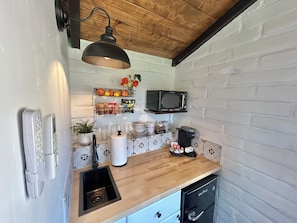 Microwave, coffee/tea maker, toaster, cookware/dishes/utensils