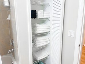 Jetted bath, hair dryer, towels, soap