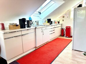 Fridge, microwave, stovetop, coffee/tea maker