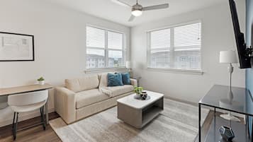 Apartment, 1 Bedroom | Living area | 50-inch Smart TV with digital channels