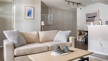 Apartment, 1 Bedroom | Living area | 50-inch Smart TV with digital channels