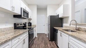 Apartment, 2 Bedrooms | Private kitchen | Microwave, oven, stovetop, dishwasher