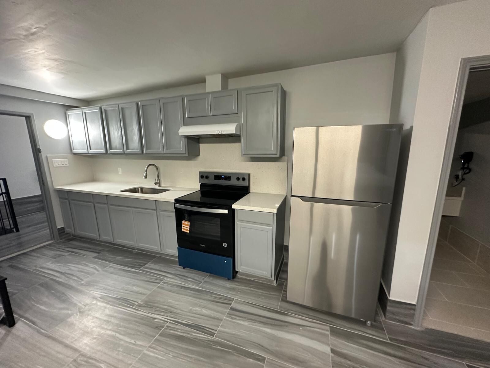 Suite familiar, varias camas, para no fumadores | Cocina privada | Refrigerador con congelador, microondas y molino para café 