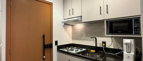 Fridge, microwave, stovetop, coffee/tea maker