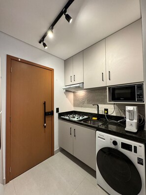 Fridge, microwave, stovetop, coffee/tea maker