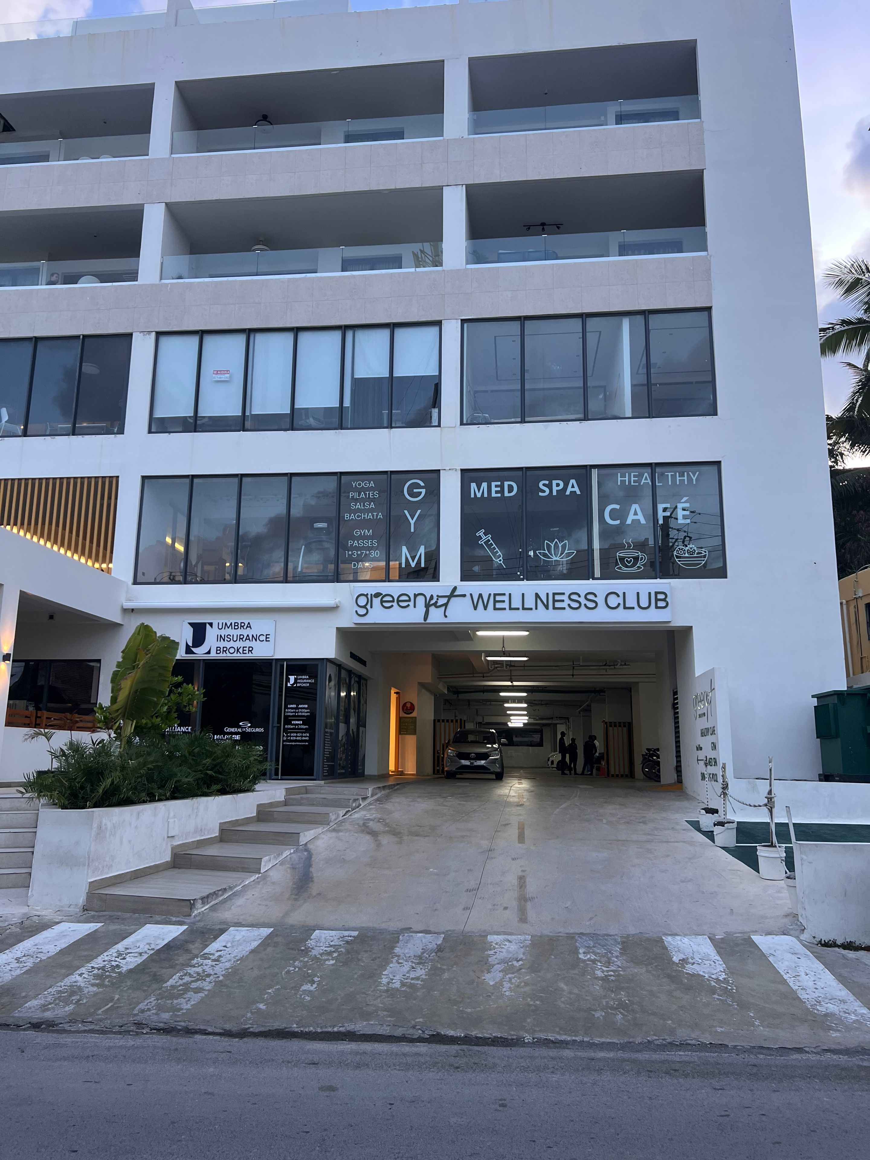 A multi-story building with a wellness club, gym, spa, and cafe.