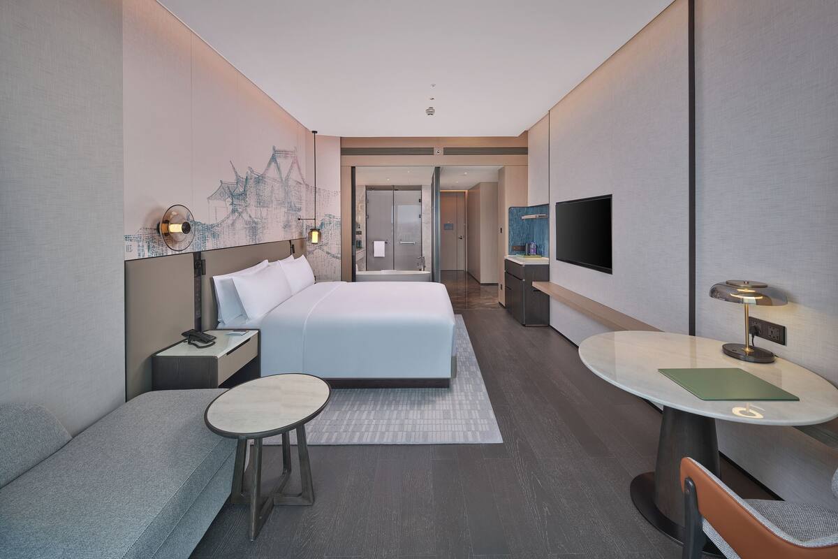 Chambre exécutive, 1 trÚs grand lit | Minibar, bureau, fer et planche à repasser, accÚs au Wi-Fi (inclus)