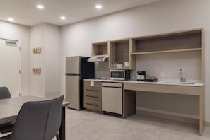 Suite, 1 King Bed with Sofa bed (Roll-In Shower) | Private kitchen | Full-size fridge, microwave, stovetop, dishwasher