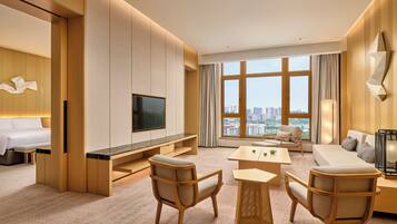 Deluxe Suite, 1 King Bed | Living area | 55-inch LED TV with digital channels