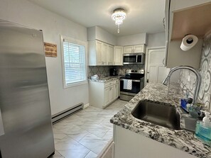 Fridge, microwave, oven, stovetop - Charming Main-Level Getaway (Waukegan)