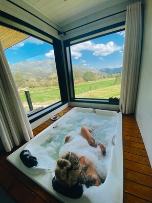 Honeymoon Cabin | Bathroom | Separate tub and shower, jetted tub, hair dryer, bathrobes