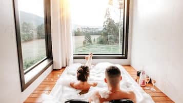 Romantic Cabin, Balcony, Mountain View | Bathroom | Separate tub and shower, jetted tub, hair dryer, bathrobes