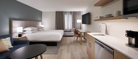 Tabla de planchar con plancha, wifi gratis y ropa de cama